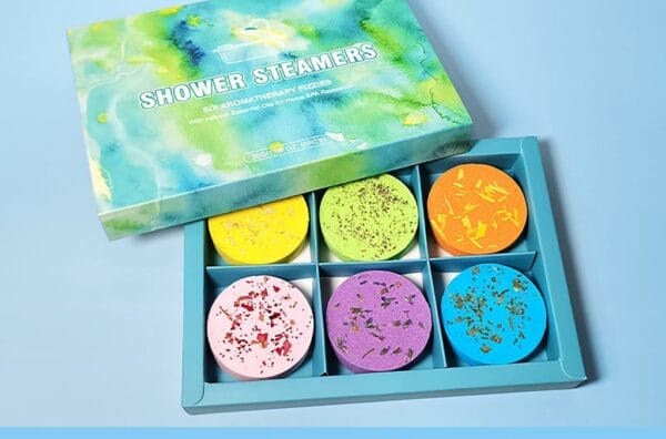 A set of six vibrant Zen Fizzers Rose Shower Steamers, showcasing features such as natural materials, essential oil enrichment, and rich foam.