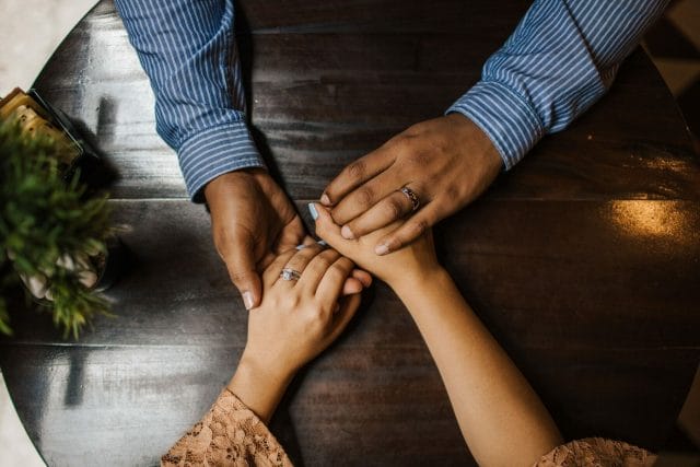 couple on their date holding each other;s hands, how to have a successful date