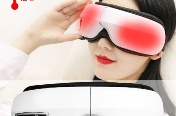 A person indulges in the soothing comfort of the BENBO Eye Massager Foldable Eye Mask, with its digital panel displaying a relaxing 42°C warmth.