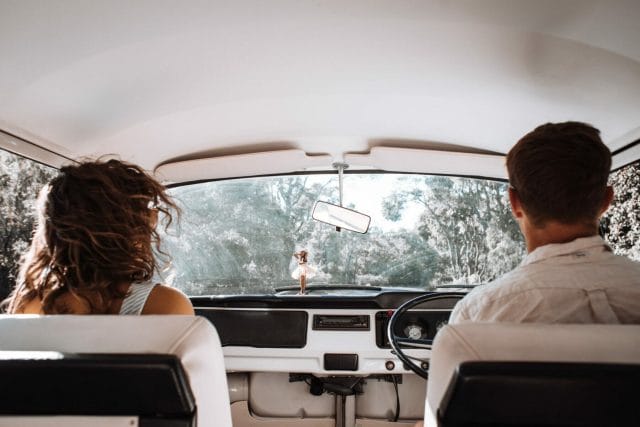 a couple sitting inside a car | Navigating the Uncertainty of a Situationship: Pros & Cons