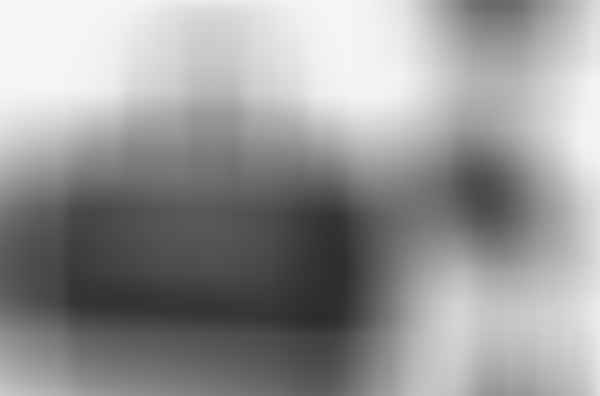 A OZUKO Waterproof Large Capacity Duffle Bag with a pair of shoes and a pair of shoes.