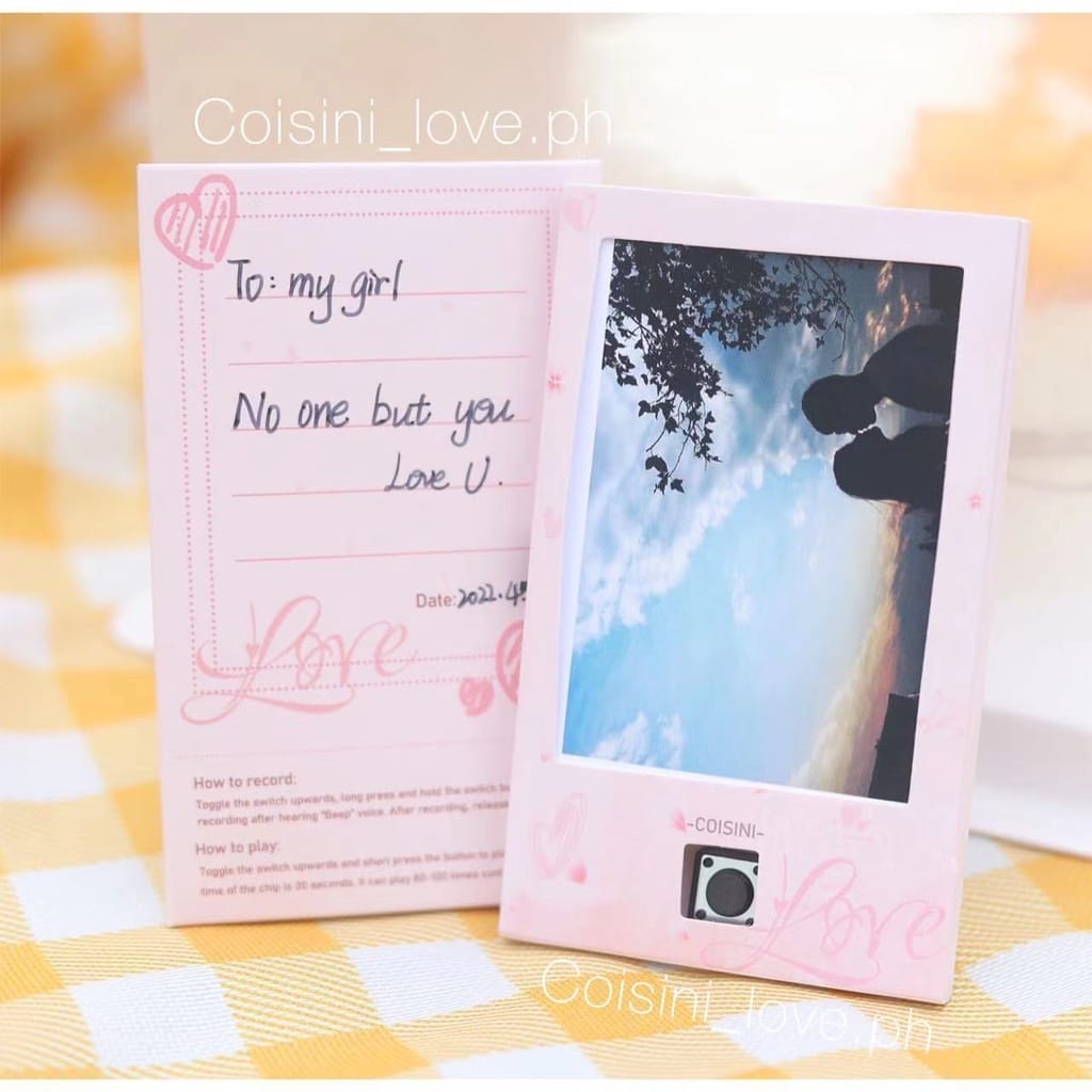 A pink Photo Voice Music Recorder Card photo frame with a heart on it.