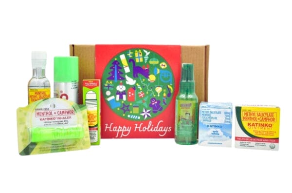 Katinko Gift Set NB featuring a selection of sprays, ointments, and inhalers, presented in front of a holiday-themed box.