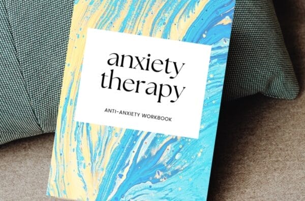 An anxiety therapy book on a couch.