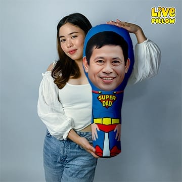 A woman is holding a LIVEPILLOW Custom Human Bolster Pillow.