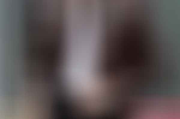 A man wearing a PRIA Men's Genuine Leather Jacket.