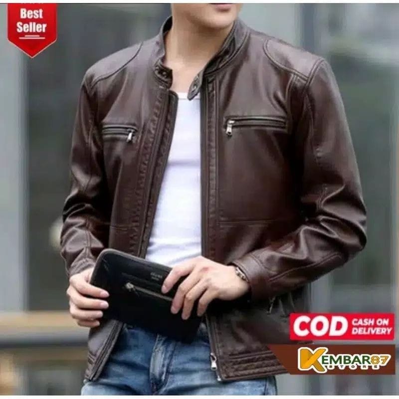 A man wearing a PRIA Men's Genuine Leather Jacket.