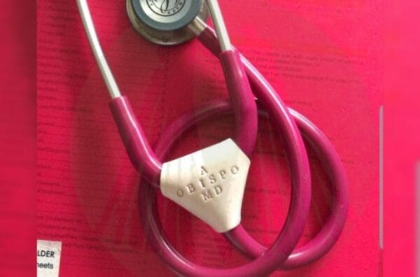Genuine Leather Malaya Stethoscope Tags on top of a pink paper.