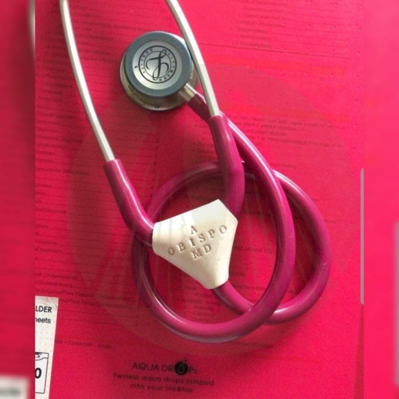 Genuine Leather Malaya Stethoscope Tags on top of a pink paper.